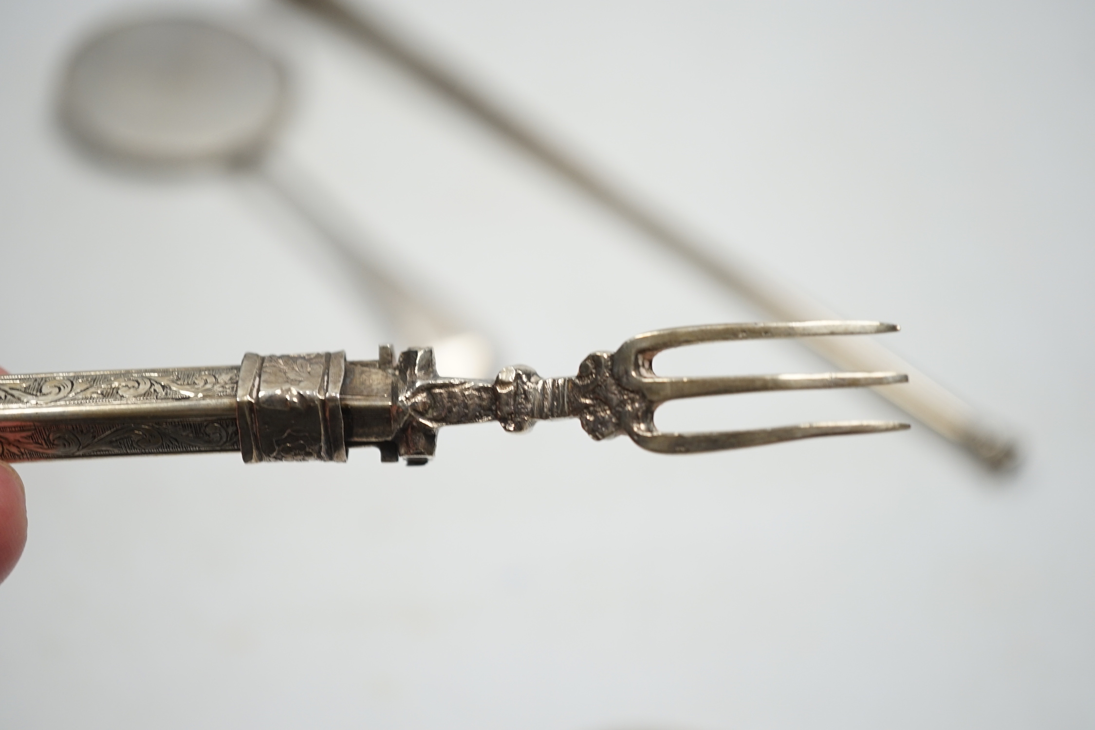 A George V silver biscuit server, a Dutch white metal combination fork and spoon and a late Victorian silver hunting horn, by Sampson Mordan & Co, London, 1900?, 30.2cm.